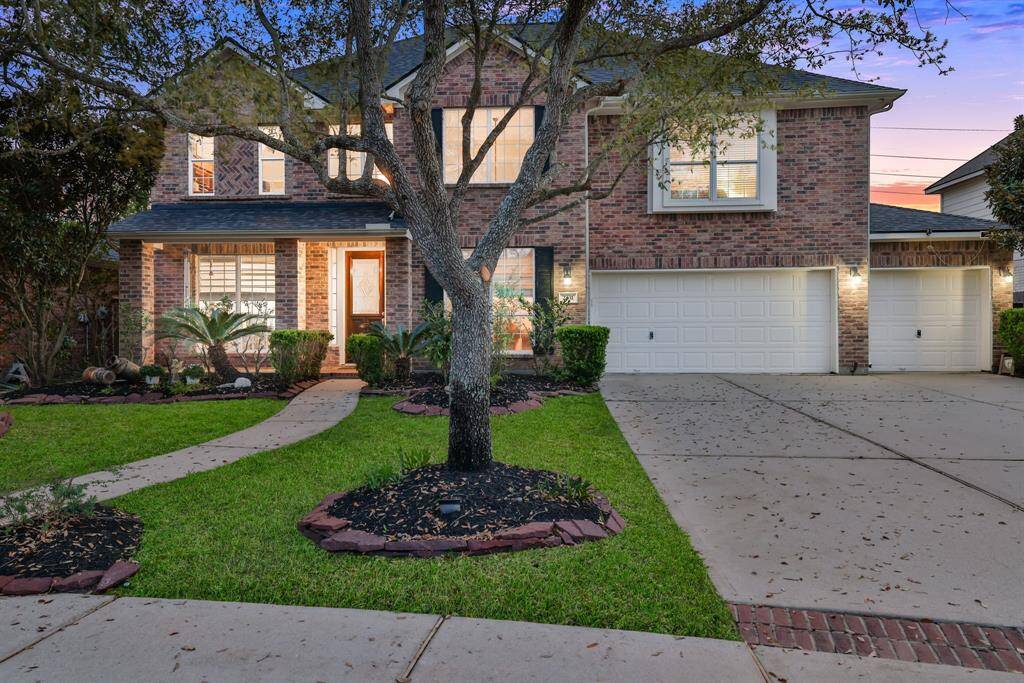 Stately brick elevation w/3 car garage
