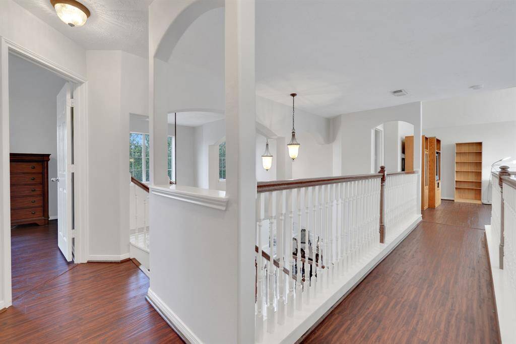 Landing at the top of the stairs looking toward the game room