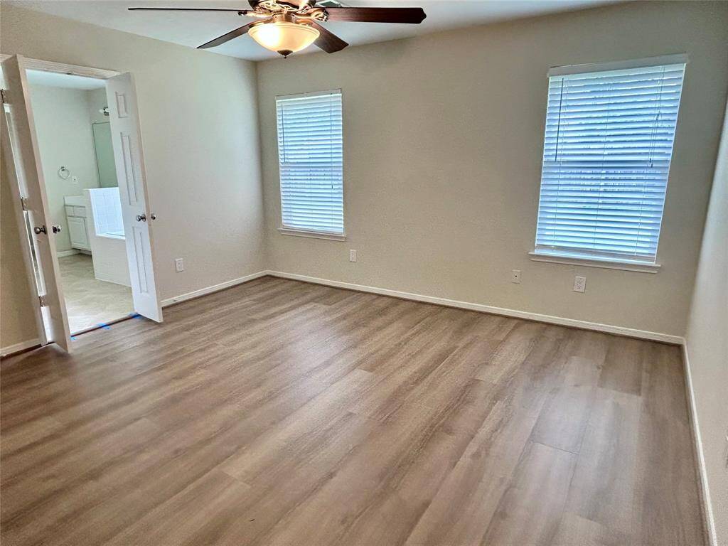 Master bedroom with window facing backyard