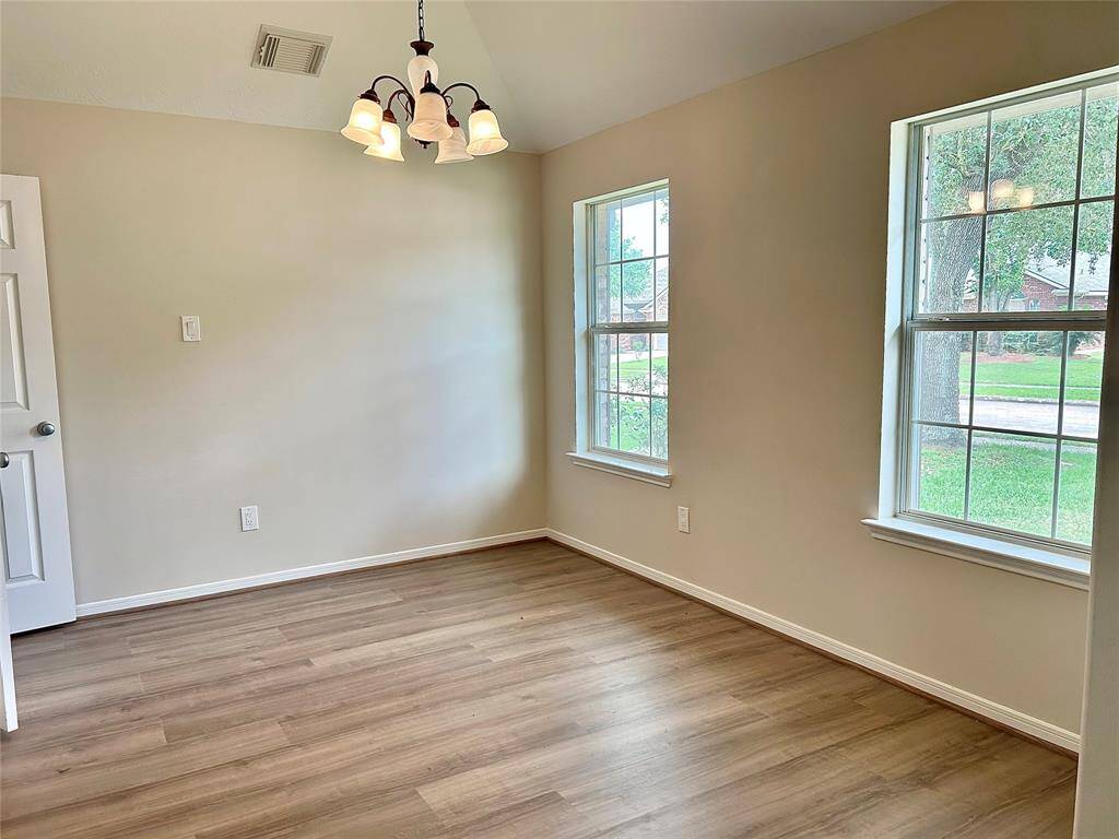 Formal dining room with window facing front yard
