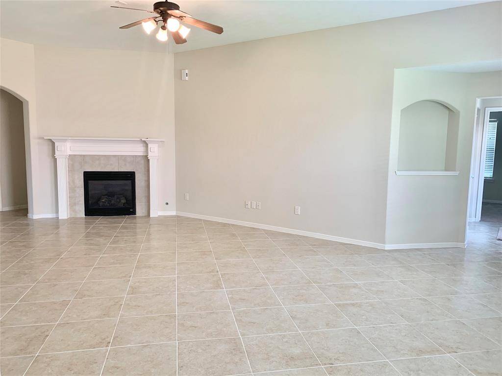 Living room with right entry to study room and master bedroom
