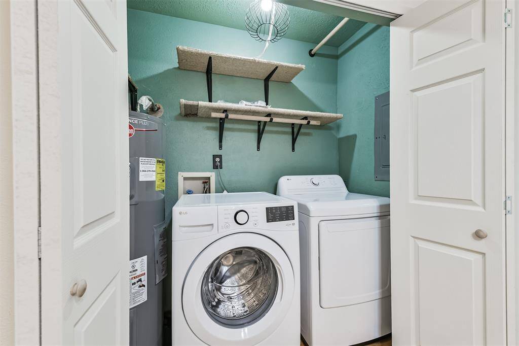 Utility room inside with hot water heater & doors