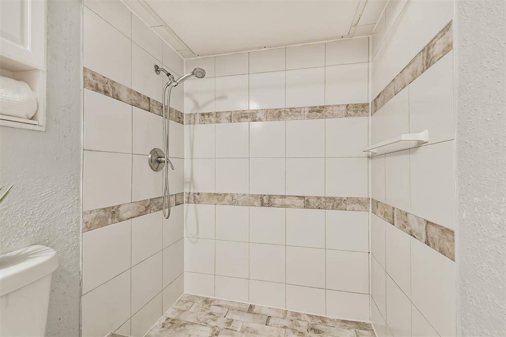Remodeled primary bathroom w/step in shower