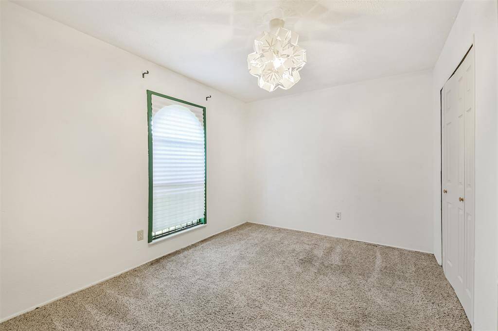 Guest bedroom #2 w/beautiful light fixture