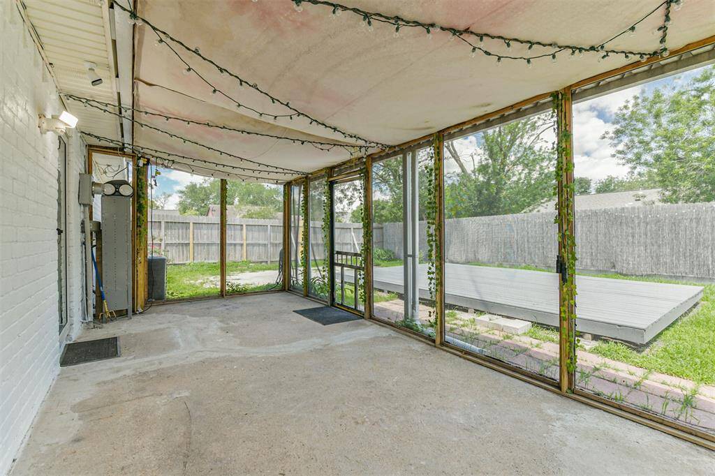 Back covered patio w view of whole yard.