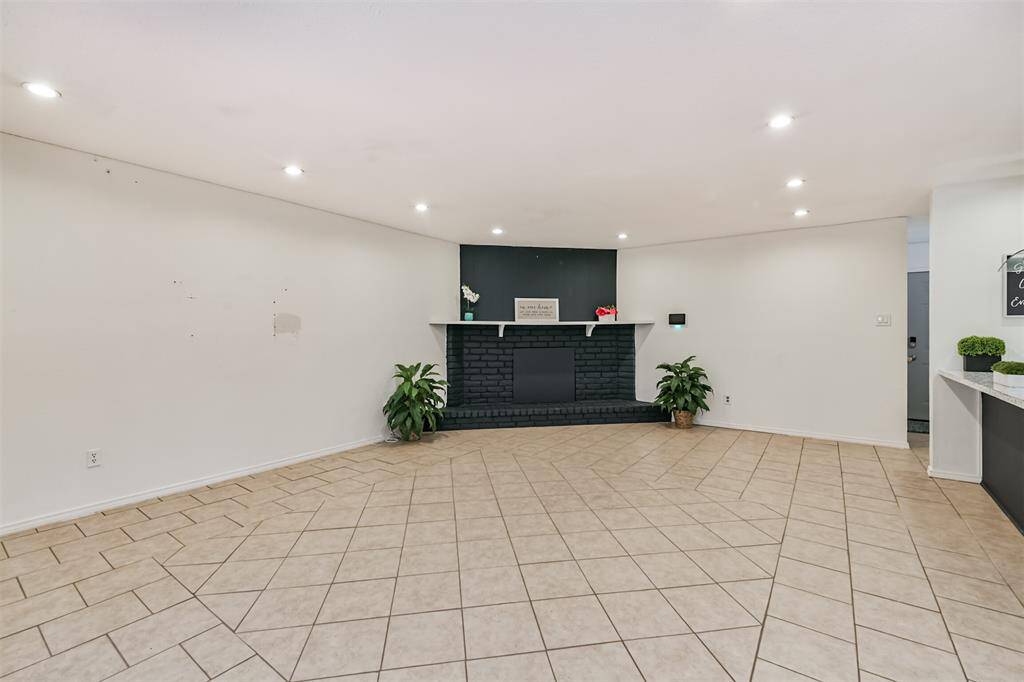 Living room with tile, recently painted fireplace