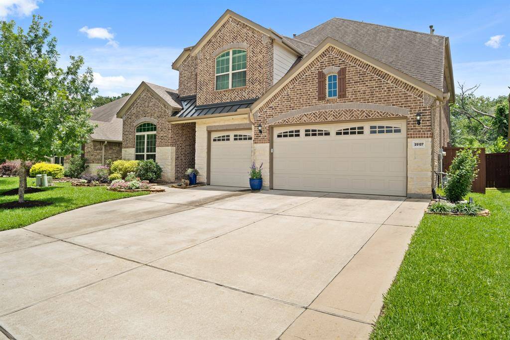 This is a spectacular spacious two-story brick home with a three-car garage. The well-maintained front yard features lush green grass and mature trees, providing excellent curb appeal and upgraded driveway extension.
