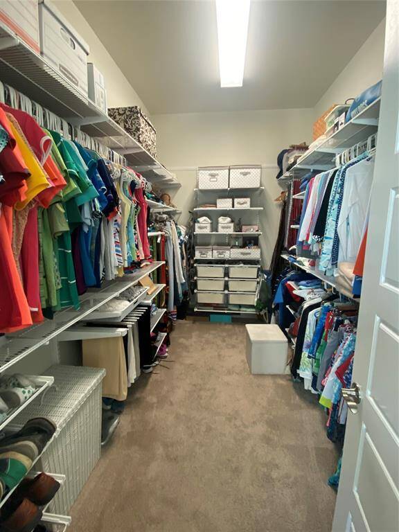 Upgraded closet with Custom Elfa Closet system from Container Store.