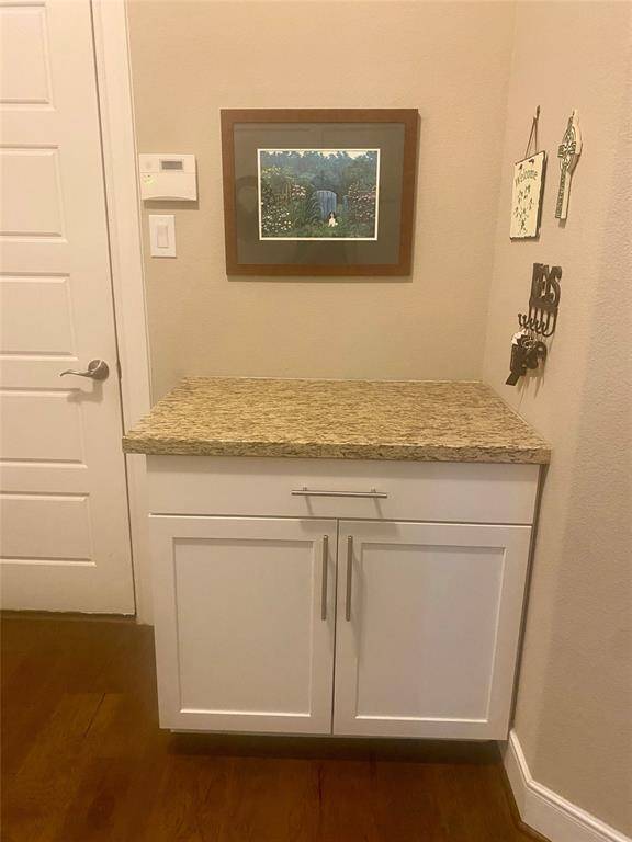 Added 36" cabinet with granite countertop for "drop off" and storage with granite countertop at garage door entry.