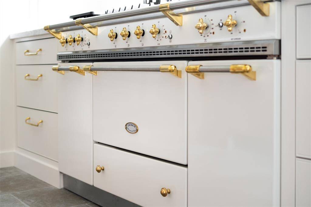 Custom select cream colored Lacanche range is functional and beautiful