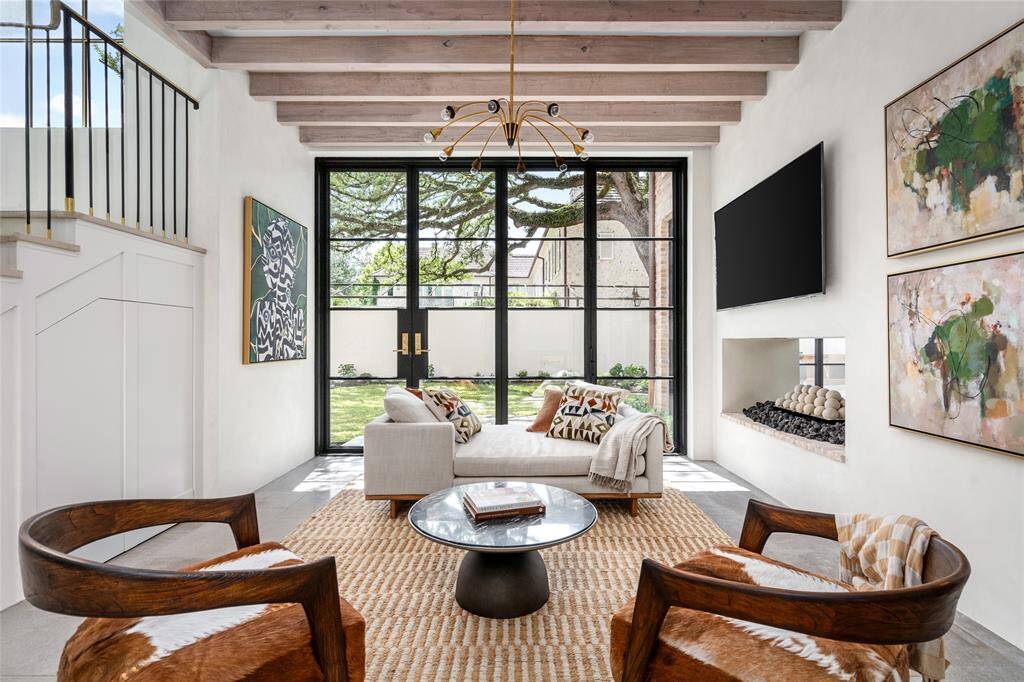 Comfort and back yard views, steel doors with lever capability to fully open, two-sided fireplace with gas ball pyramid