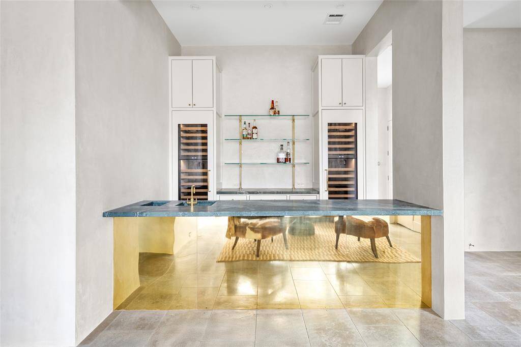 Powder bath (South) with Custom designed unlacquered brass vanity with verde mable counter, zellige tile walls, whimsical encaustic tile flooring and hand painted walls