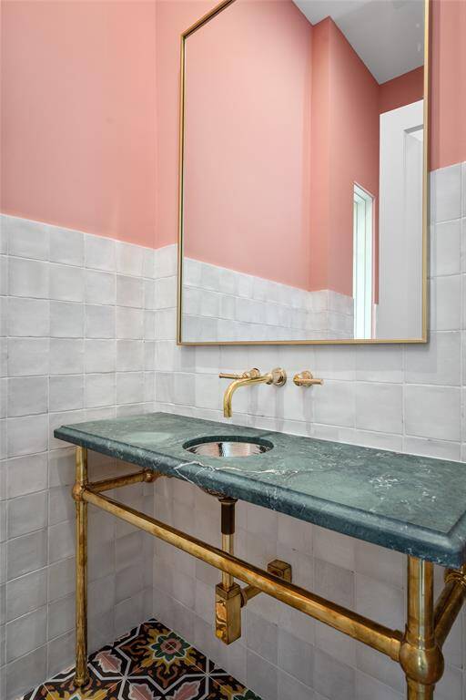 Luxurious Primary Bedroom Suite with large windows, a Juliet style balcony overlooking the backyard with dual bathrooms, closets/dressing rooms
