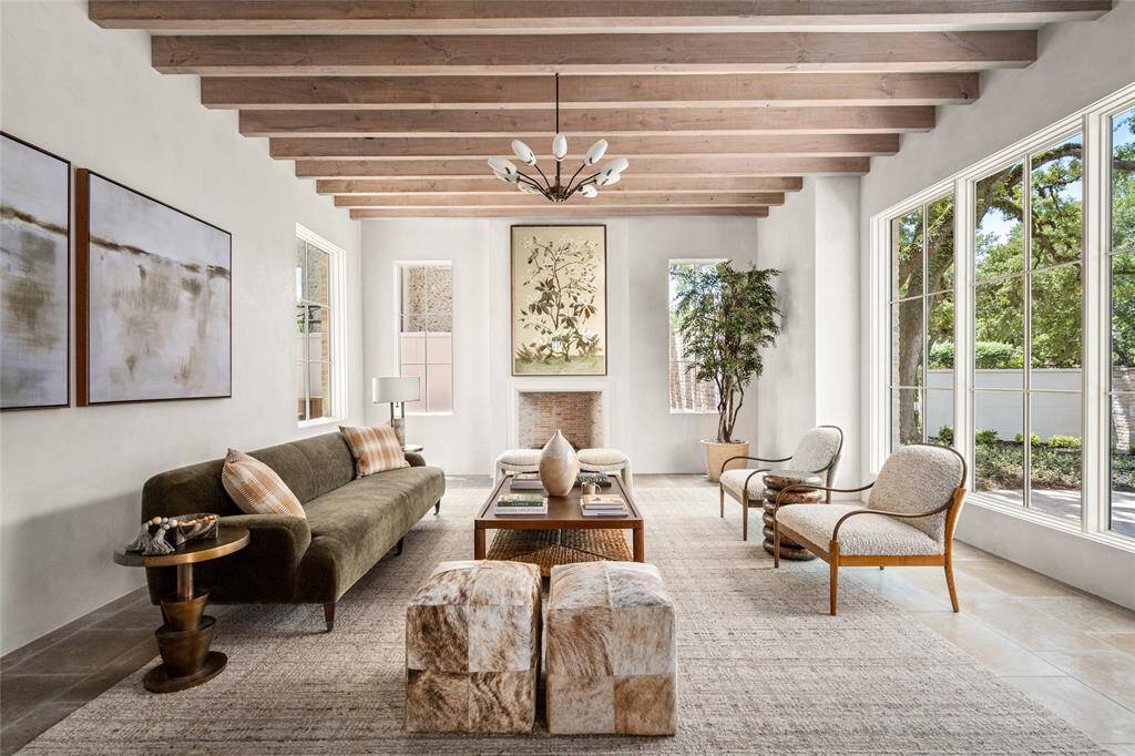A grand Formal Living Room for entertaining with a hand cut and laid brick isokern with a plaster mantle and gas logs