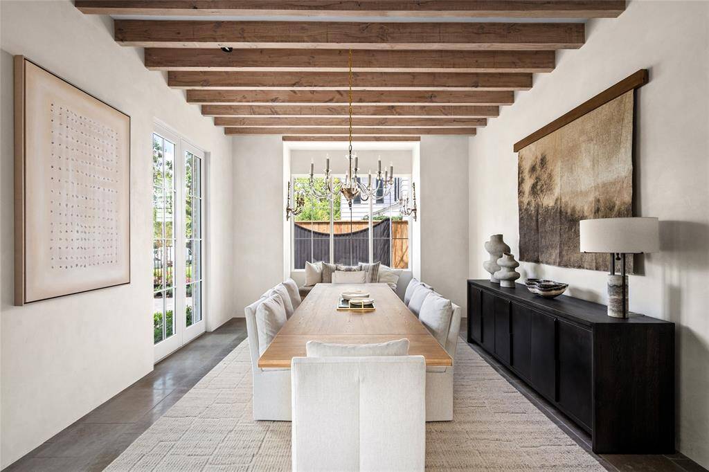 The Formal Dining Room with a beamed ceiling, wonderful windows, wall space and grand dimensions to host gatherings