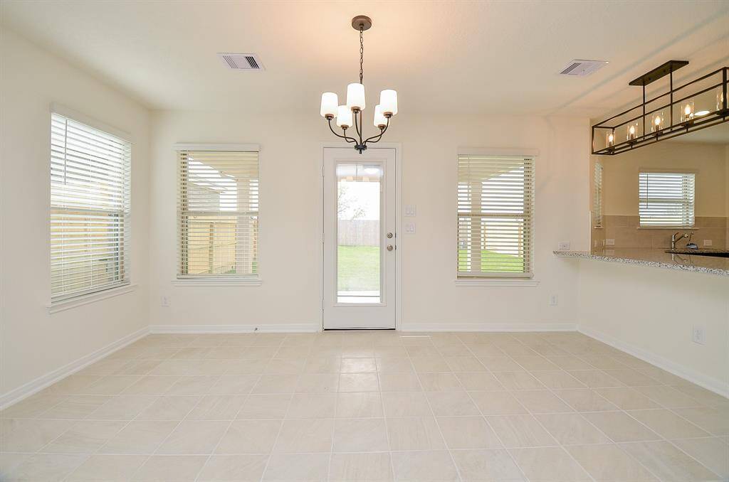 Spacious open-concept living area seamlessly connects the living room and kitchen, perfect for modern living and entertaining.