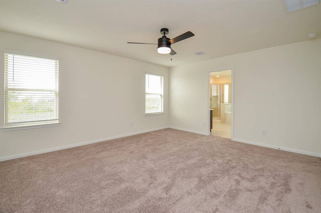 Experience the elegance of the master suite with its double vanity and abundant natural light.
