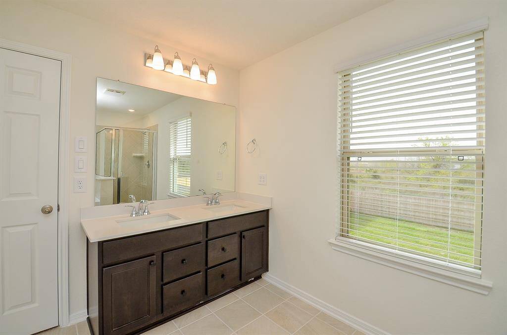 This master has as well a spacious walk in closet for all your storage needs.