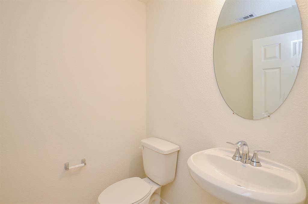 Convenient half bath perfect for guest use.