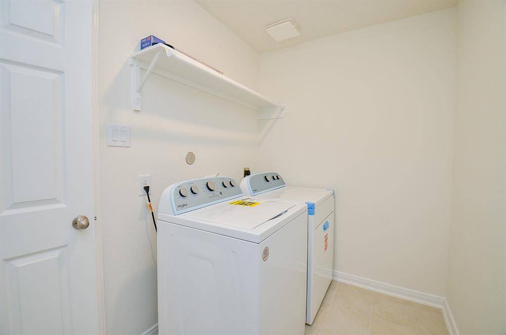 Spacious two-car garage with additional storage space.
