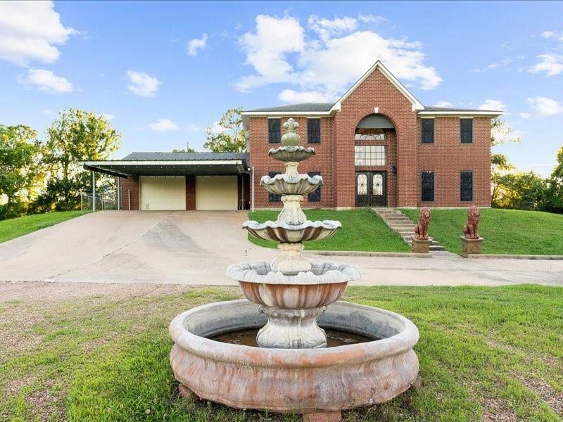 Beautifully designed inside and out with a multi-tiered fountain that sits prominently in the front yard.