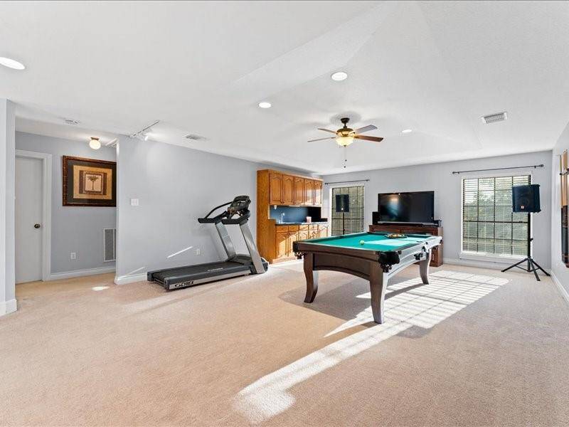 Spacious recreational/game room upstairs.