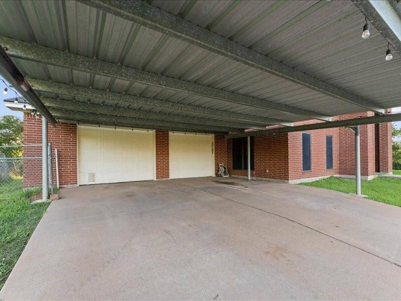 Covered parking area, with the 2-car garage inside.