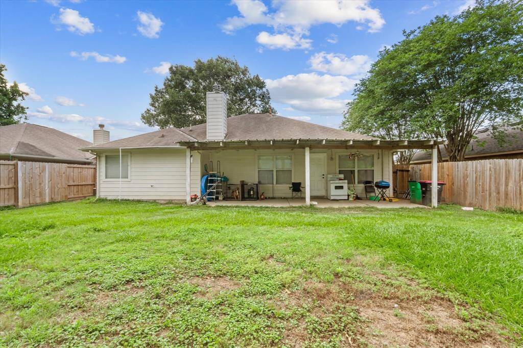 Spacious Backyard with a covered patio.
