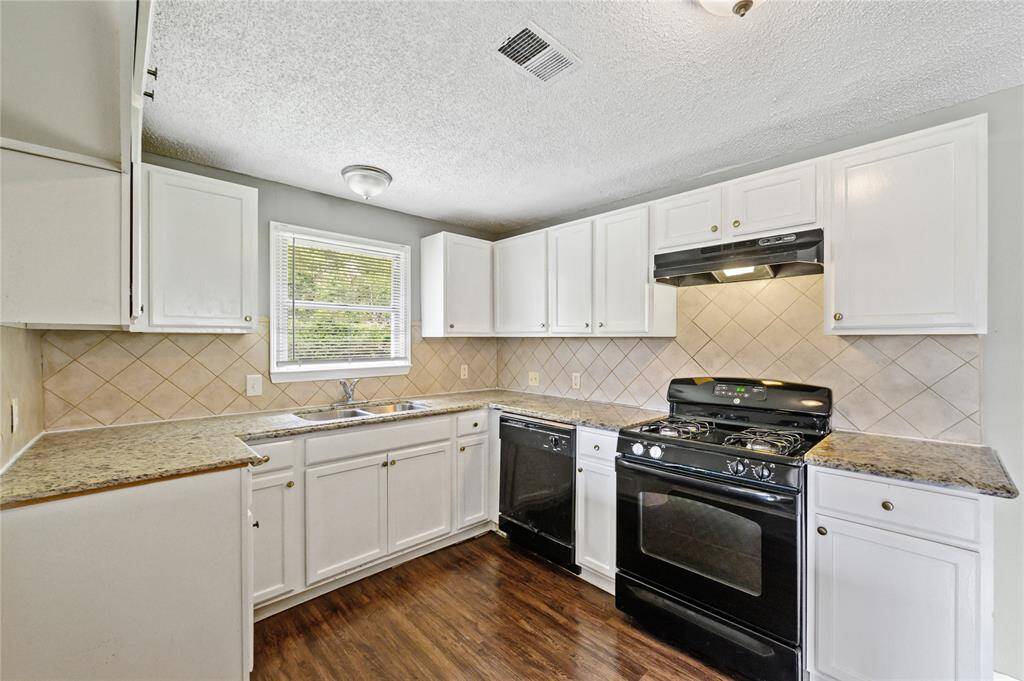 Upgraded granite, refreshed cabinetry and backsplash.