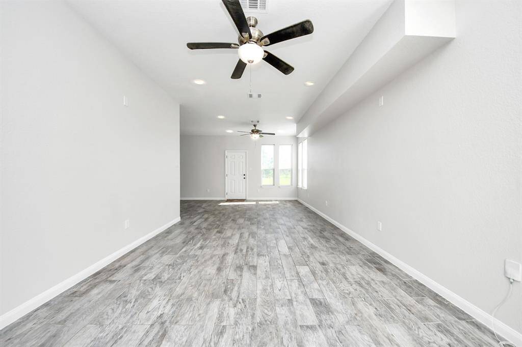 The heart of the home, this spacious living room offers a warm and inviting ambiance. Bathed in natural light, it provides a versatile space for entertaining guests or enjoying quiet evenings with loved ones.