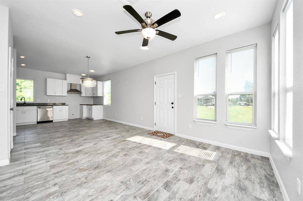 The open concept design seamlessly connects it to the kitchen and dining area, fostering an atmosphere of togetherness.