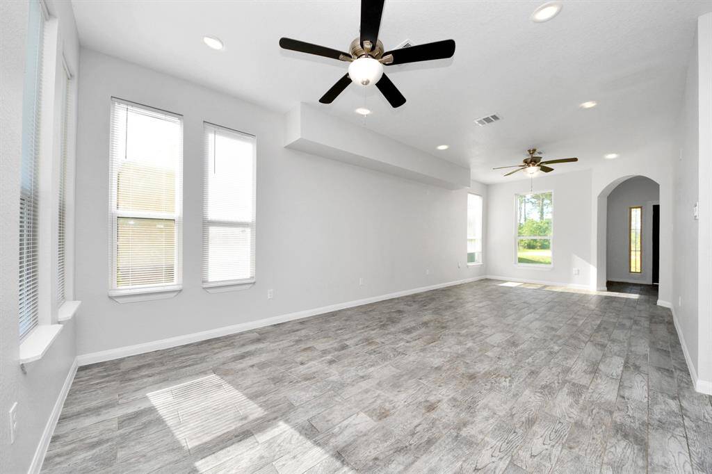 The open concept design seamlessly connects it to the kitchen and dining area, fostering an atmosphere of togetherness.