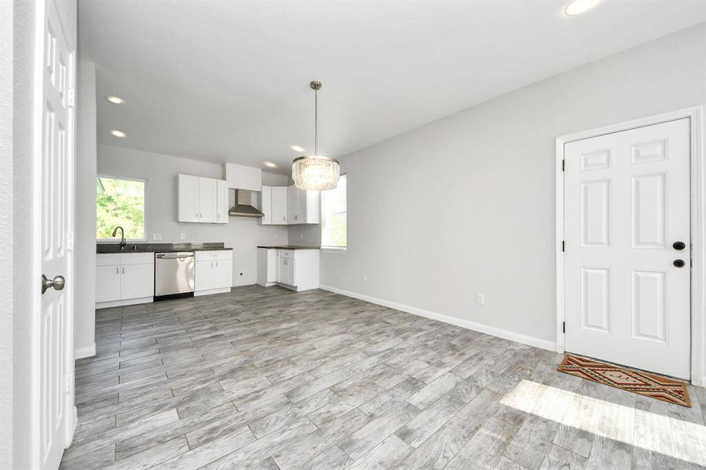 The open concept design seamlessly connects it to the kitchen and dining area, fostering an atmosphere of togetherness.