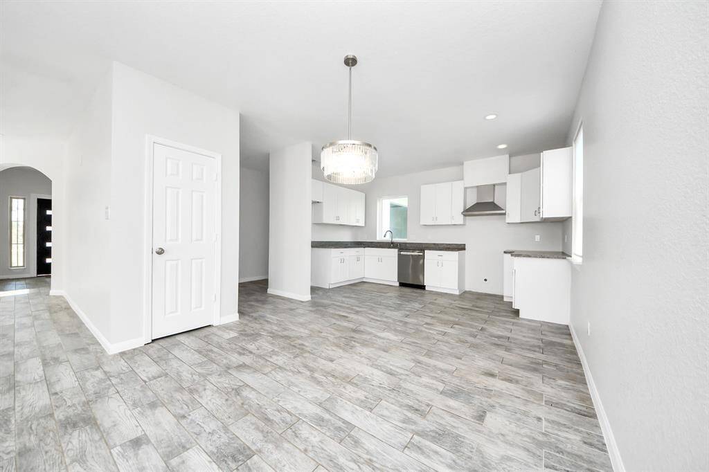 The open concept design seamlessly connects it to the kitchen and dining area, fostering an atmosphere of togetherness.
