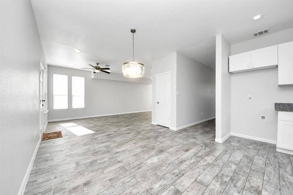 The open concept design seamlessly connects it to the kitchen and dining area, fostering an atmosphere of togetherness.