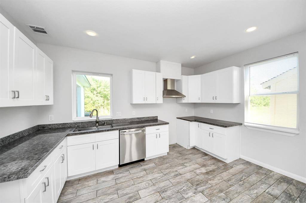 The heart of the home, this kitchen is a chef's delight. Modern appliances, ample storage space, and a convenient center island make meal preparation a breeze. Imagine the joy of gathering around the dining table, creating lasting memories with family and friends.