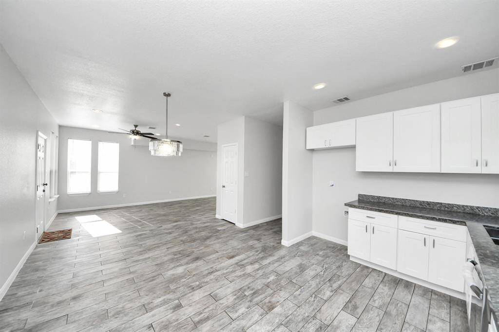 The heart of the home, this kitchen is a chef's delight. Modern appliances, ample storage space, and a convenient center island make meal preparation a breeze. Imagine the joy of gathering around the dining table, creating lasting memories with family and friends.