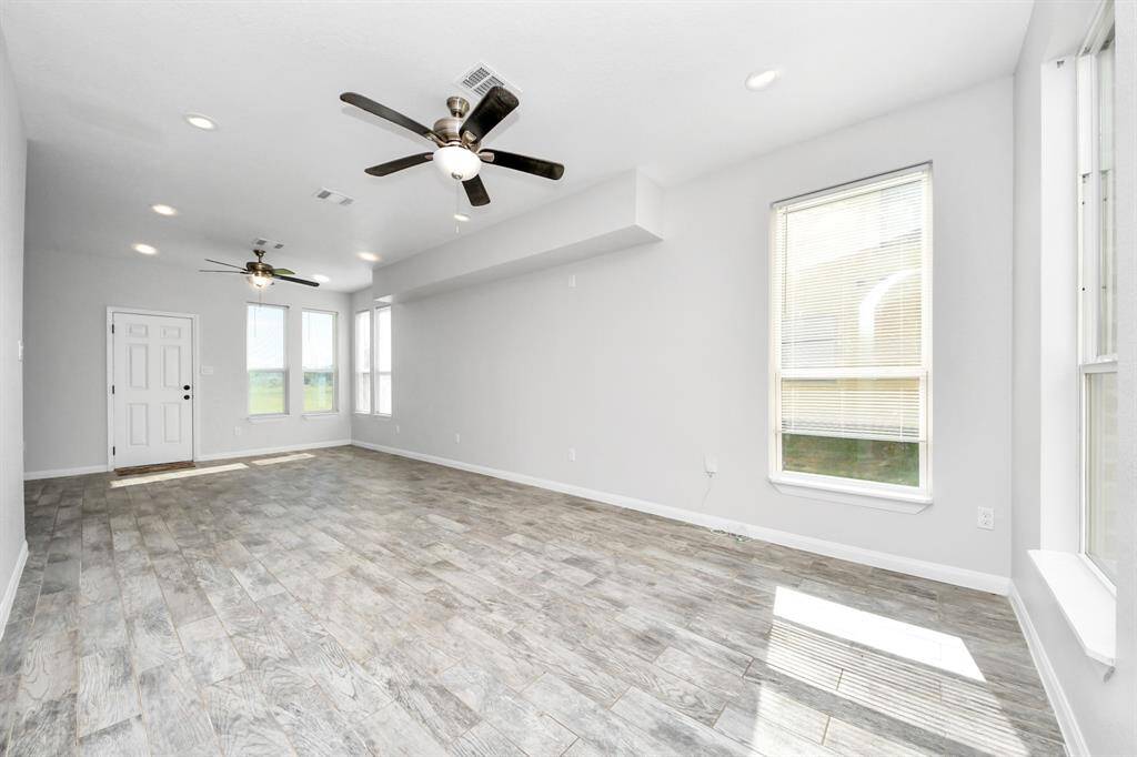 The heart of the home, this spacious living room offers a warm and inviting ambiance. Bathed in natural light, it provides a versatile space for entertaining guests or enjoying quiet evenings with loved ones.