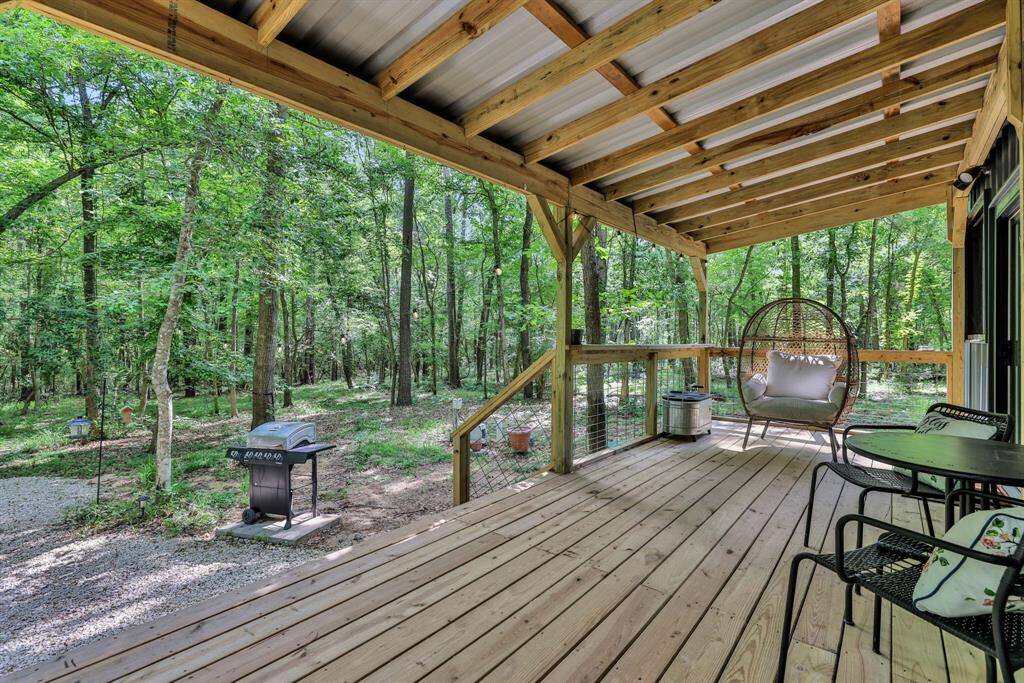 Relax on the covered back deck and enjoy the scenic view