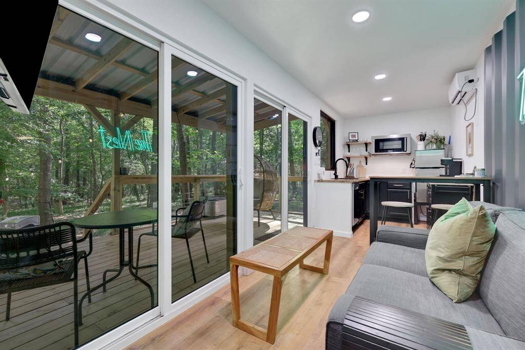 Features these sliding glass doors for fabulous views of the property