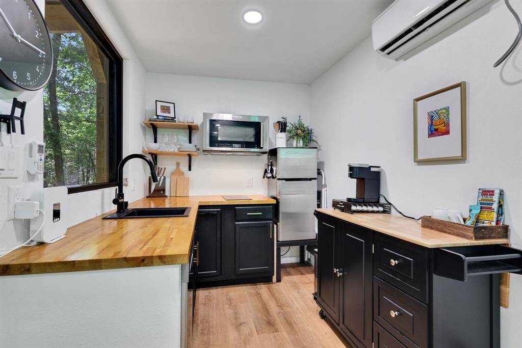 Seamless design - there are washer/dryer hookups in the kitchen if desired