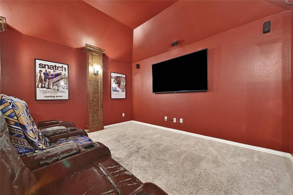 Media Room with upgraded paneling, lighting and surround sound.