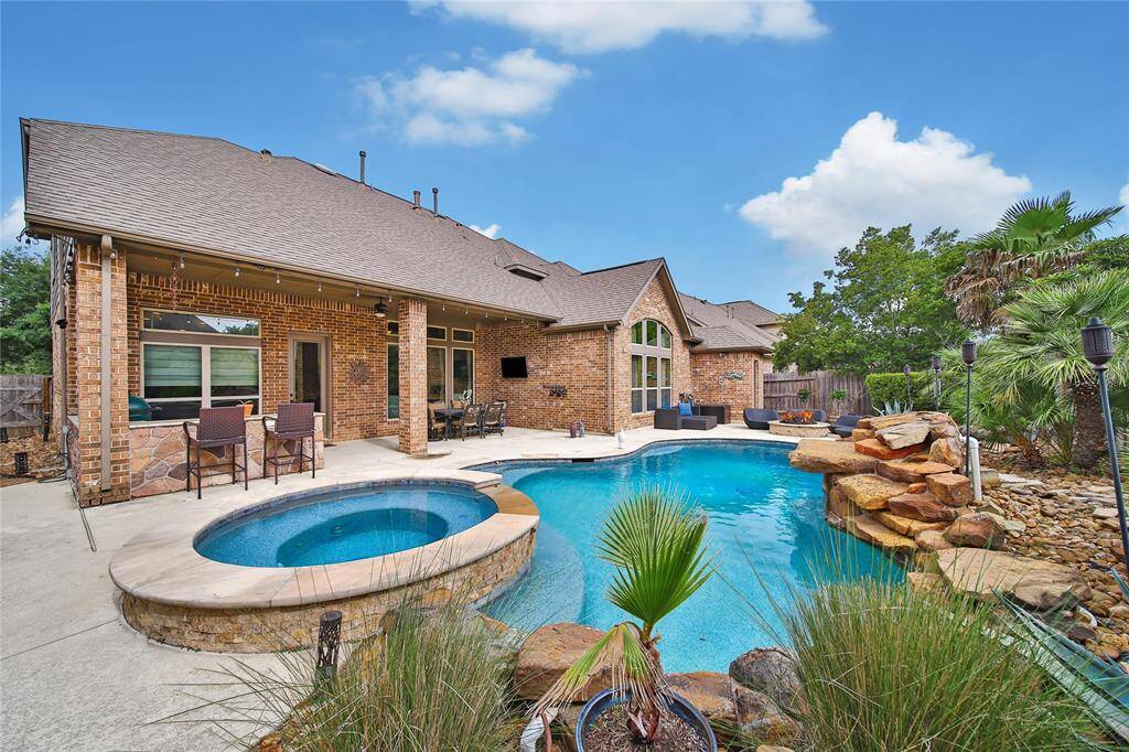 Hot tub is spacious, sellers have a pool fence to protect children and pets