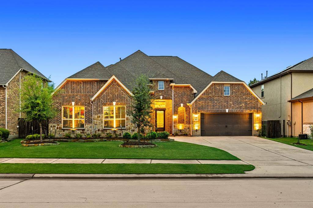 Welcome home to 27834 Astoria Brook Ln. located on a quiet street in Cinco Ranch and zoned to Katy ISD! This stunning home has lovely curb appeal, a well-manicured lawn, beautiful landscaping, stone/brick elevation, dark stained front door with glass detailing, covered front porch, traditional style, beautiful outdoor lanterns and a double wide driveway!
