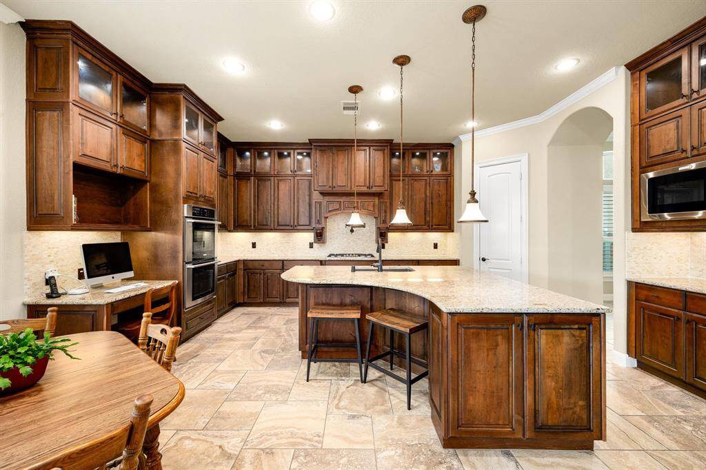 Any chef's dream, this stunning kitchen is perfect for everyday life as well as entertaining family and friends! Extra large kitchen island is perfect for conversation or that much needed space to lay out your party spread for everyone to enjoy! Large windows provide lovely views of your backyard and plenty of natural lighting throughout the day.