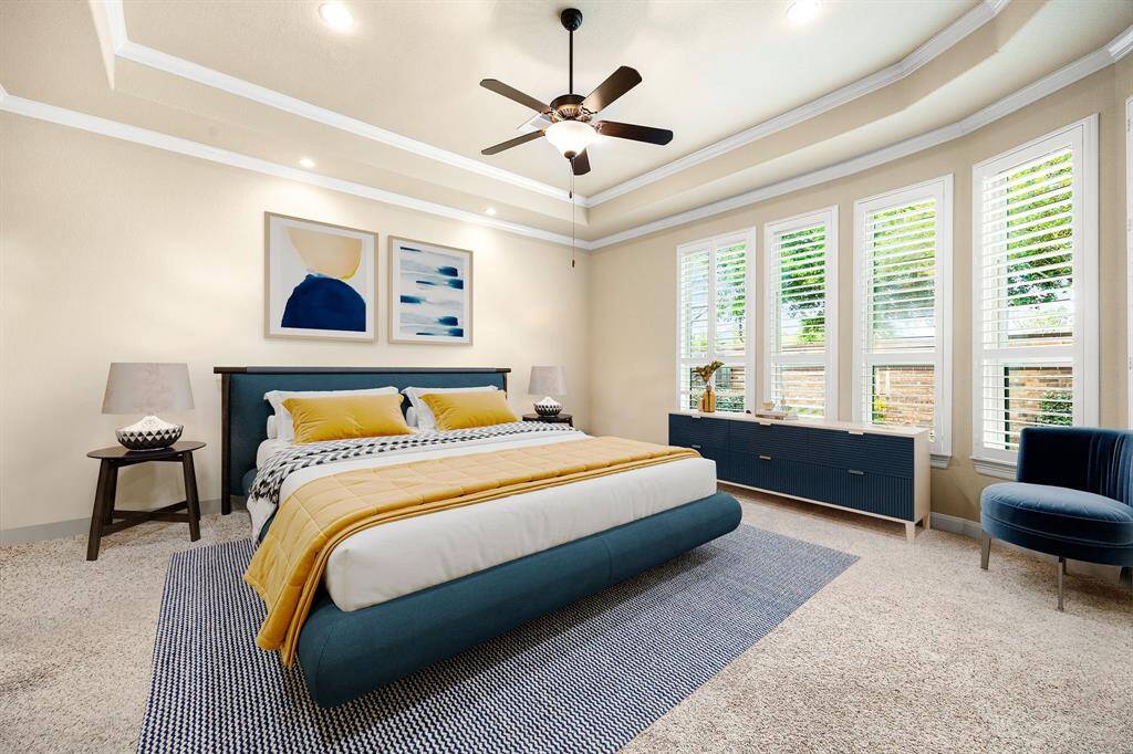 What a wonderful place to come home to, this stunning primary suite greets you with gorgeous plush carpet, a warm custom paint, high ceiling, crown molding, ceiling fan with lighting, lovely arched windows with shutters allowing in natural light brightening up this spacious primary bedroom, with extra space for a seating area. *Virtually Staged