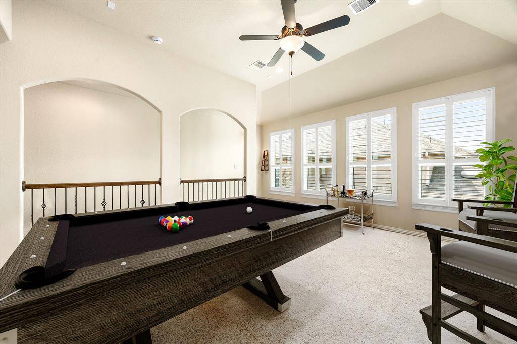 Come upstairs and enjoy a day of leisure in this fabulous game room/media room! This is the perfect hangout spot or adult game room, this space features plush carpet, high vaulted ceiling, recessed lighting, custom paint and storage closet. *Virtually Staged