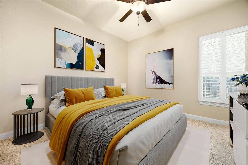 Retreat to this inviting bedroom, featuring vaulted ceilings, plush carpeting, and abundant natural light for a peaceful, relaxing escape. *Virtually Staged
