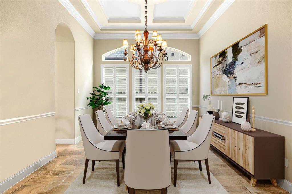 You and your guests will certainly dine in style in this amazing formal dining room! Featuring a gorgeous chandelier, large window with shutters, neutral paint, high ceilings, crown molding, chair rail and tile flooring. Perfect space to entertain family and friends. *Virtually Staged