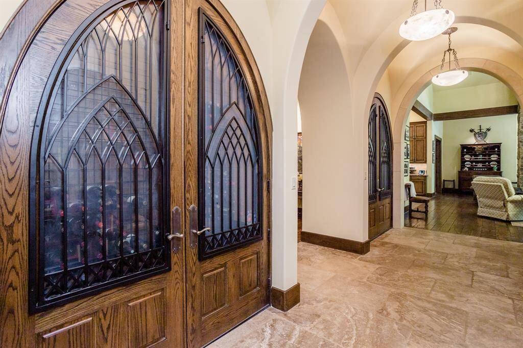 Two cooled wine closets flanking the entry to the dining room. 288 bottle capacity each.